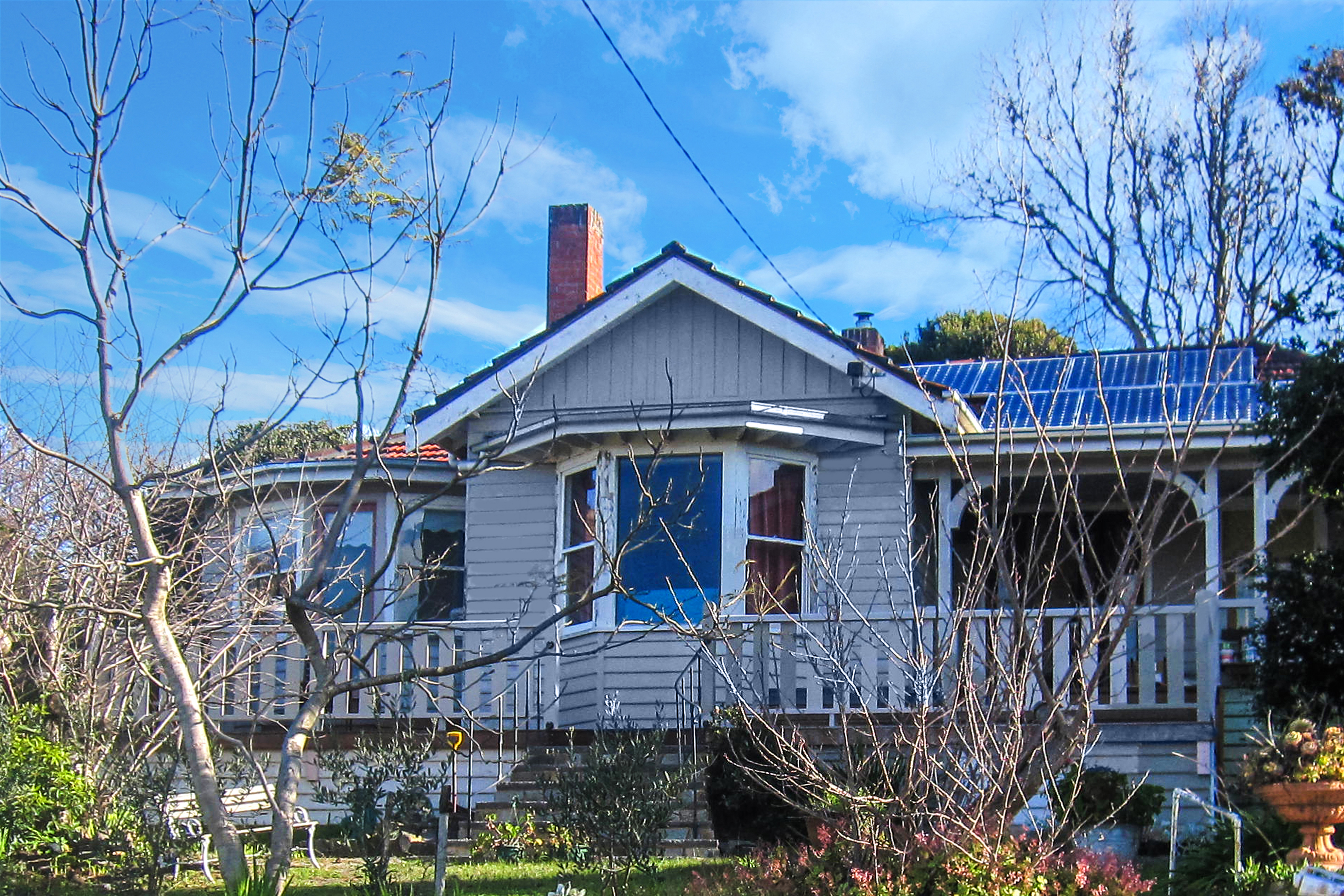 Frankston South Home, after new front deck, stone steps and restored facade Passive solar design - house renovation
