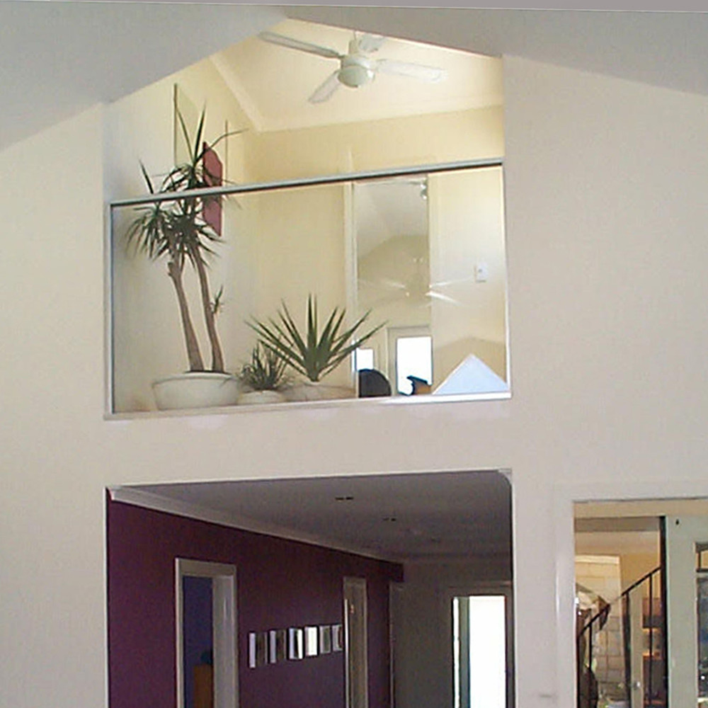 Ecohome, designed by BP Architects. Low business ecological footprint. Library and Office overlooking kitchen, sustainable ecohome designed by BP Architects